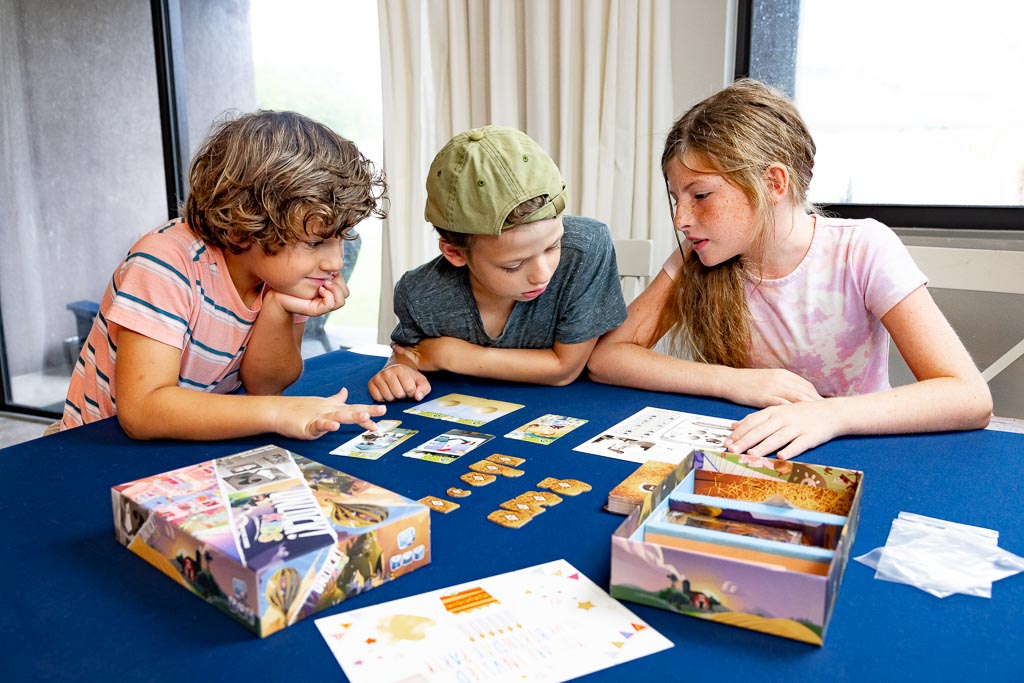 young people playing board games